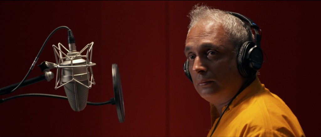 Playback singer, Ashok (Piyush Mishra), takes notes on his performance.